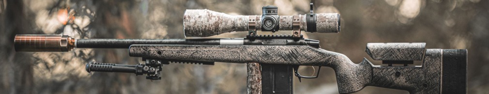 Custom bolt-action rifle with camo stock, suppressor, and optic—built by Knepper Firearms in Prescott, AZ for precision shooting.
